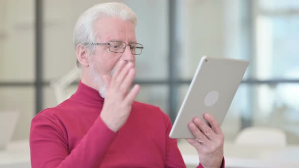 Successful Old Man Celebrating on Tablet