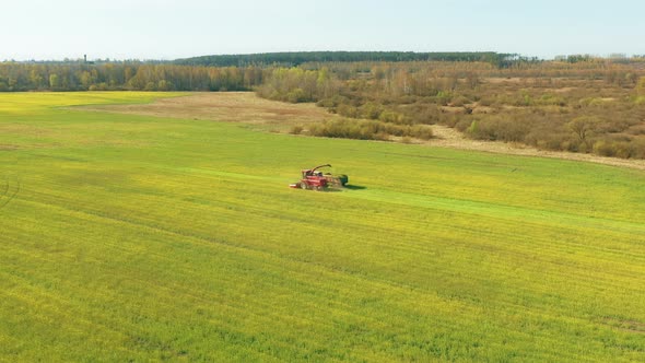 Elevated View Of Combine Harvester Tractor In Field