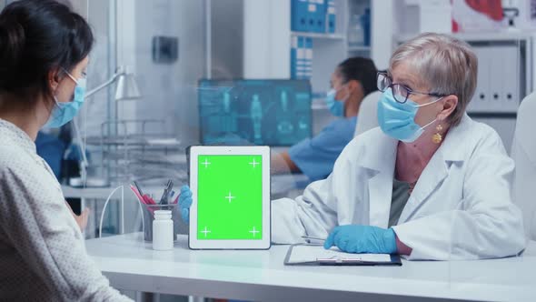 Doctor Showing Green Screen Tablet