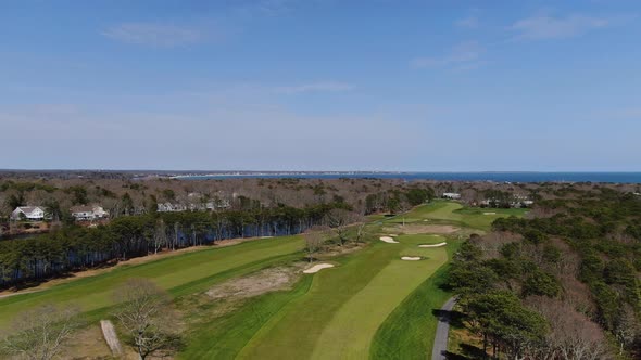 Luxury green and vibrant golf field of Osterville, MA. Aerial descend view