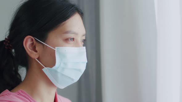 Close-up portrait Asian woman wears a facial mask before the start of fitness or yoga.