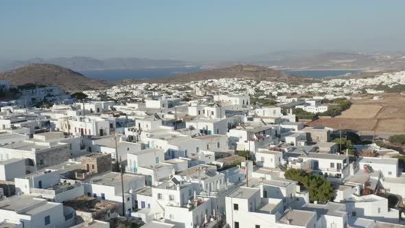 Wide Aerial View of Greek Village with White and Blue Houses