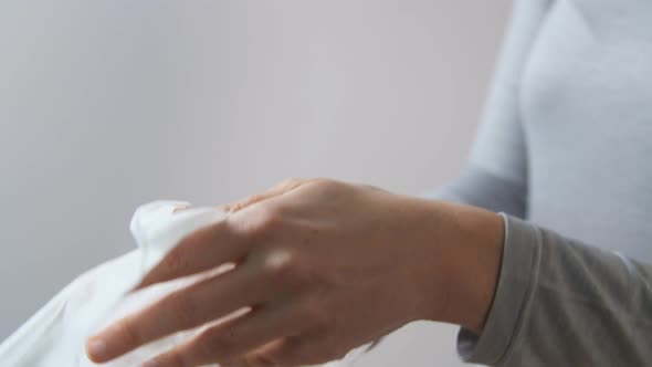 Woman Cleaning Hands with Antiseptic Wet Wipe