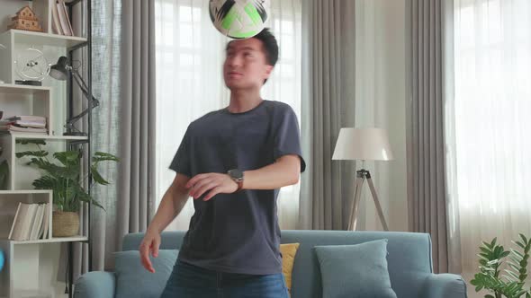 Asian Man Show Skill With Soccer Ball In Living Room, Soccer Freestyle