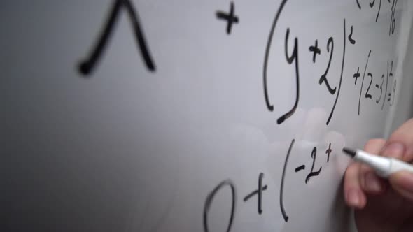 Writing Mathematics Equation on Whiteboard Math Formula Education Concept