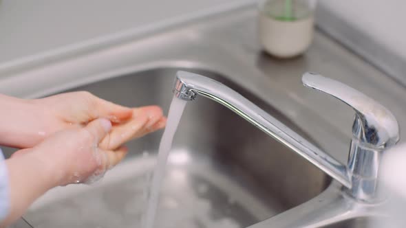 Washing and Disinfecting Hands in Sink