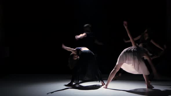 Contemporary Dance Moves of Five Dancers on Black, Shadow