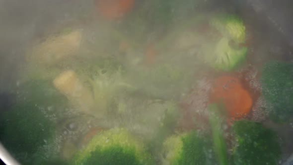 Vegetables Poured Into Pot Of Boiling Water