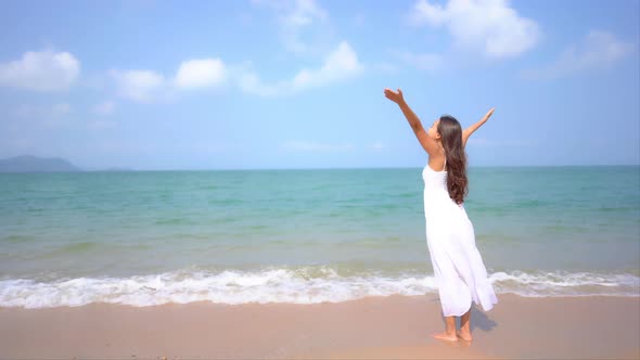 Asian woman enjoy around beautiful beach sea ocean