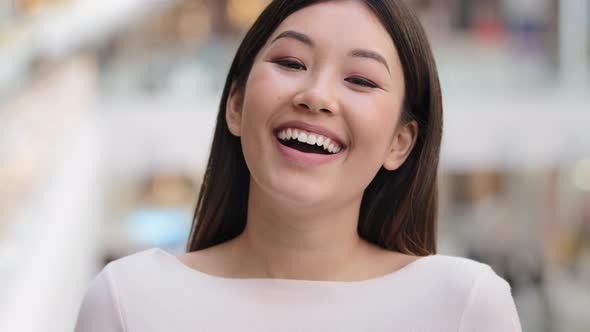Cheerful Happy Funny Female Face Asian Dent Girl Model Laughing Emotion Joke Satisfied Looking at