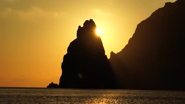 Sea Landscape with Rocky Coastline on Sunset Time