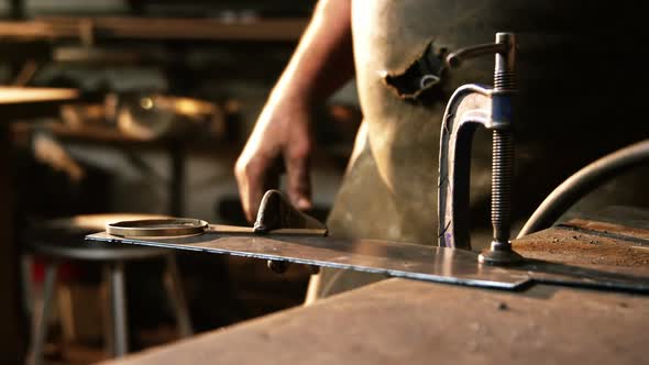 Mid-section of welder working