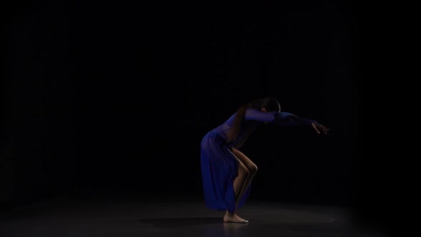 Slow Motion of an Attractive Ballerina Dancing Elements of Ballet.