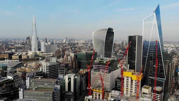 Reverse aerial view of the tallest buildings in London in the morning sun