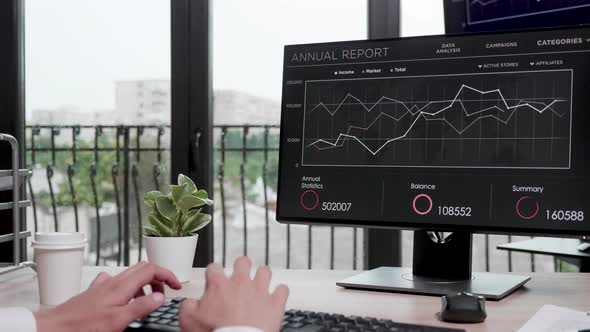 Revealing Shot of Businessman Working on the Computer