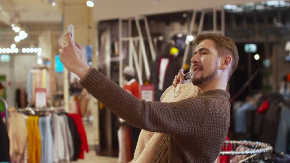 Happy Guy Takes a Selfie with a Jacket