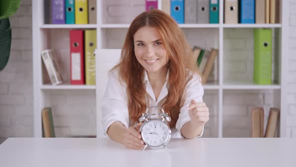 Businesswoman Point Out on Timepiece