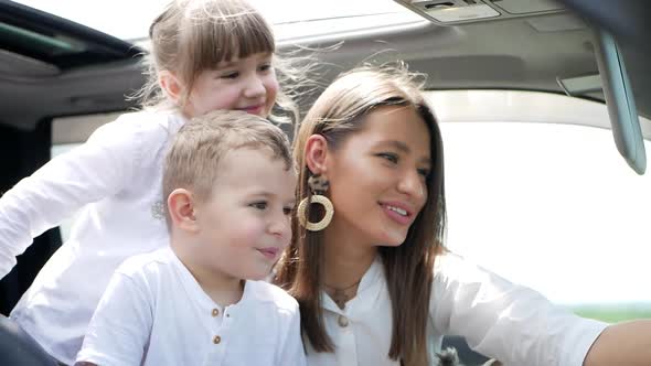 Dog Yorkshire Terrier in the car with children