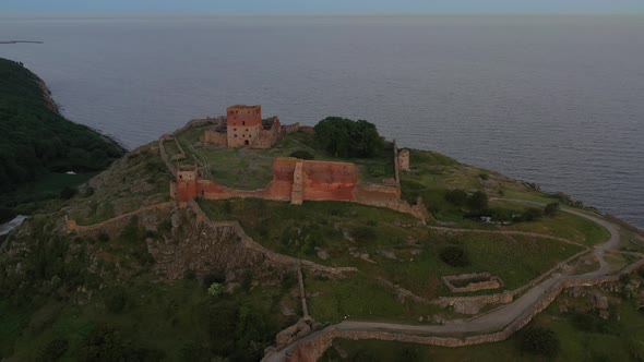 Aerial of Impressive Medieval Fortress of Hammershus Ruins at Sunset Denmark