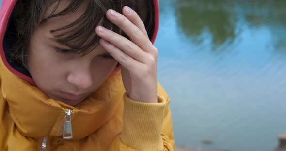 Upset Teen in City Park