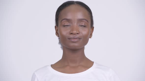 Face of Young Happy African Woman Relaxing with Eyes Closed