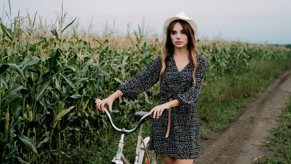 Woman on Bicycle in Countryside