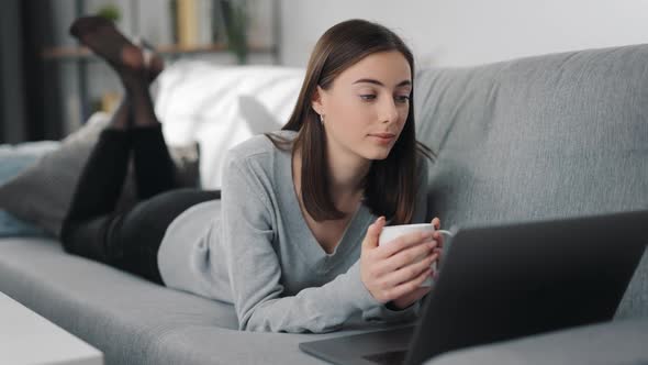 Woman on Couch with Laptop