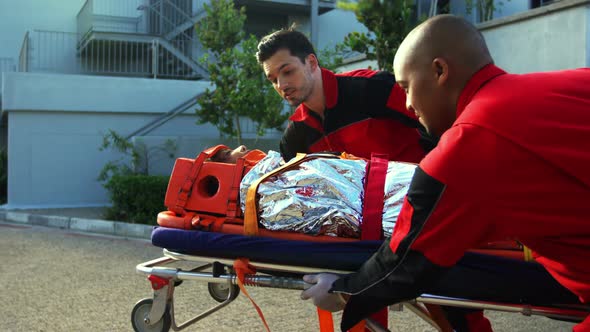 Paramedics rushing a patient in emergency