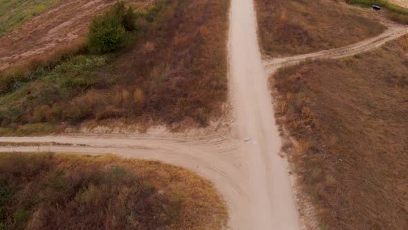 Paved road on an embankment on the rural place by the Danube River.