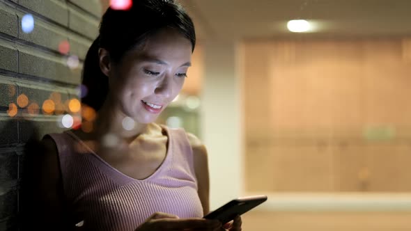 Woman Using Mobile Phone in Coffee Shop