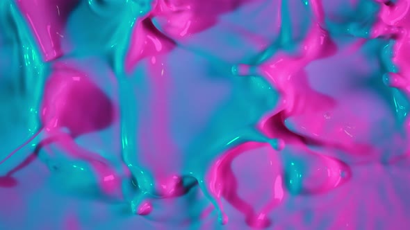 Super Slow Motion Abstract Shot of Swirling Neon Liquid at 1000Fps