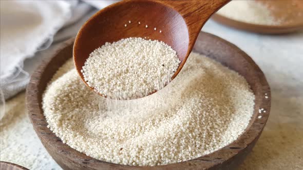 Raw uncooked fonio seeds in a bowl