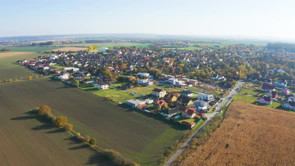 Aerial Drone Shot  Colorful Houses in a Beautiful Town in a Rural Area During Autumn