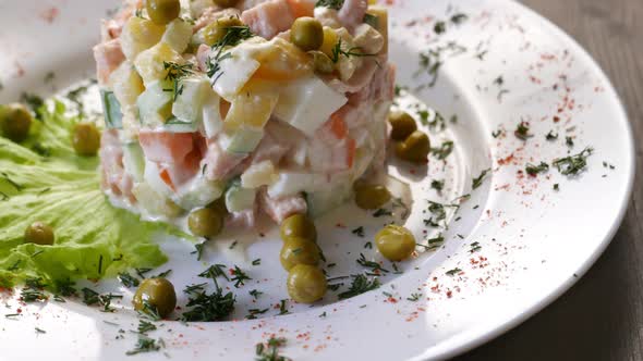 Russian Salad Olivier on a White Plate
