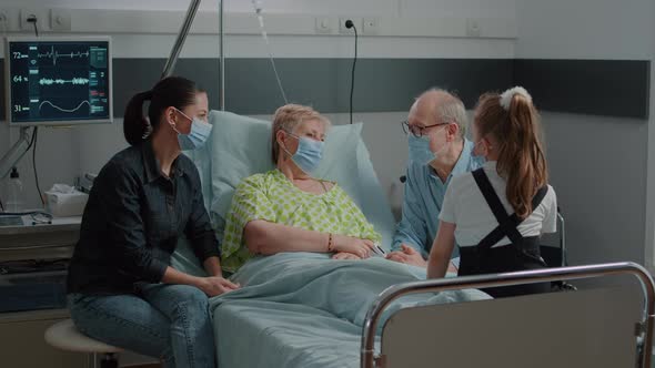 Mother and Child Visiting Retired Woman During Covid 19 Pandemic