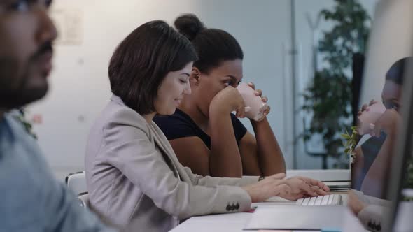 Female Colleagues Working in Office