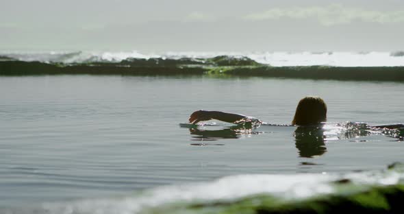 Woman playing in water at beach 4k