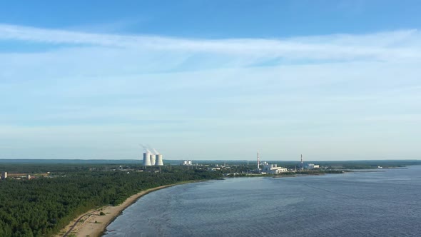 Smoking Cooling Towers at Power Plant Near Gulf