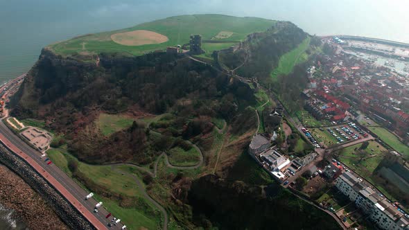 Aerial view across Scarborough castle hillside platform overlooking beautiful English harbour town