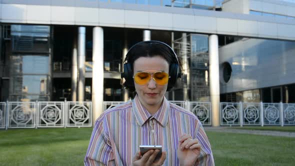 Attractive Young Woman Listening to the Music