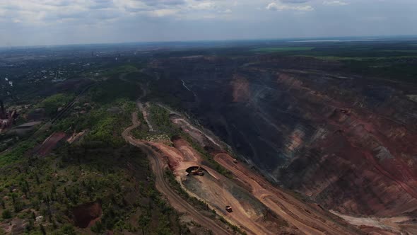 Massive Quarry with Roads in It and Around It High Angle View Film Grain