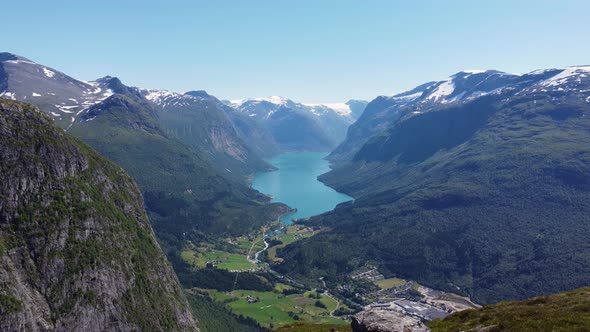 Loen lake seen from mountain Hoven - Forward moving aerial showing spectacular landscape with Josted