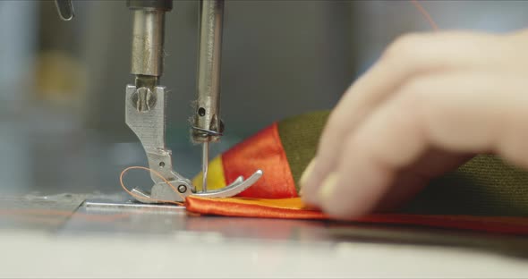 Woman Seamstress Working on an Industrial Sewing Machine.