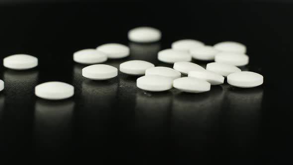 White medical pills rotating closeup. Pills and drugs. Pharmaceutical Industry.