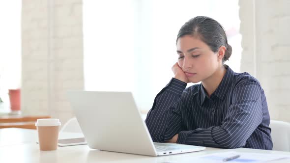 Sleepy Young Indian Woman with Laptop Having Nap