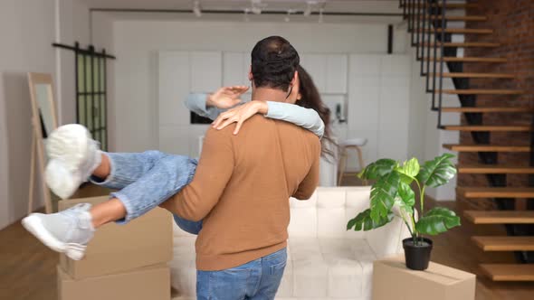 Pakistani Husband Lifting and Embracing His Wife While Feeling Delighted