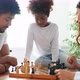 Happy Family Playing Chess Together at Home - VideoHive Item for Sale