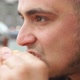 Close up of young man eating tasty burger in street food cafe - VideoHive Item for Sale
