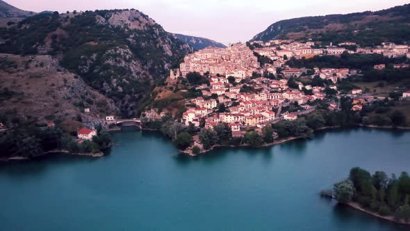 The Small Town of Barrea Near Lake Barrea at Sunset in Italy Against the Backdrop of a Mountain Zoom