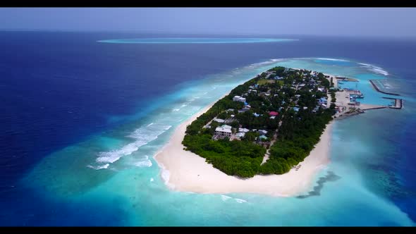 Aerial drone travel of marine coast beach trip by shallow water with white sandy background of a day